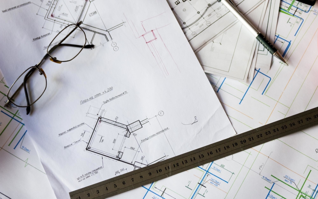 Close up view of various building blue prints