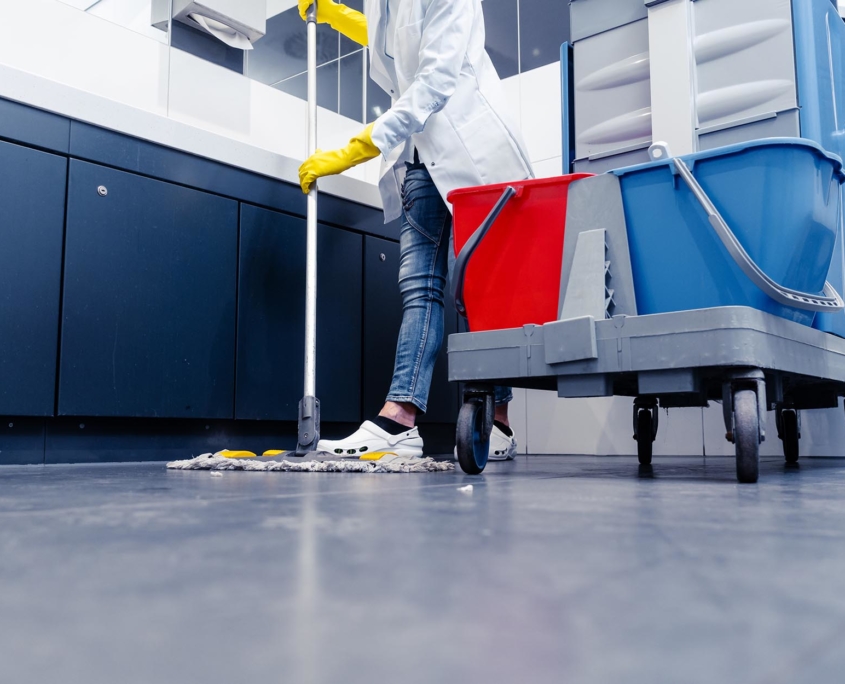 Floor view of a person using a floor sweeper